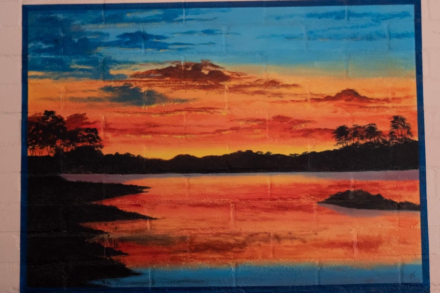 Mural depicting sunset over water painted by Leonard Lawson