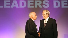 John Howard and Kevin Rudd shake hands before the start of the Leaders Debate 21st October