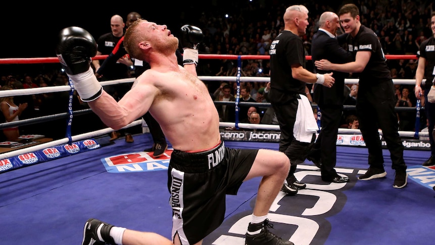 Come from behind victory ... Andrew Flintoff celebrates his win on debut.