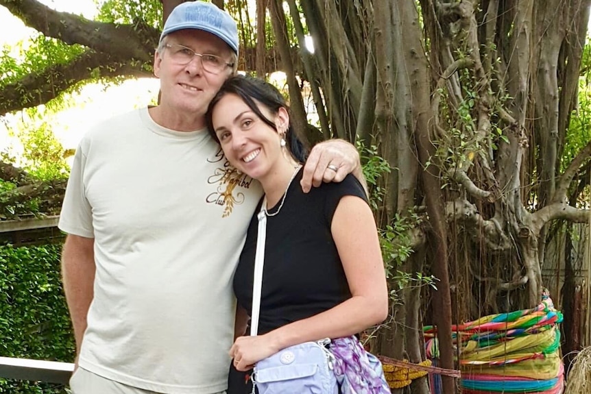 Amba Crisfield with her father, who has his arm around her shoulders.