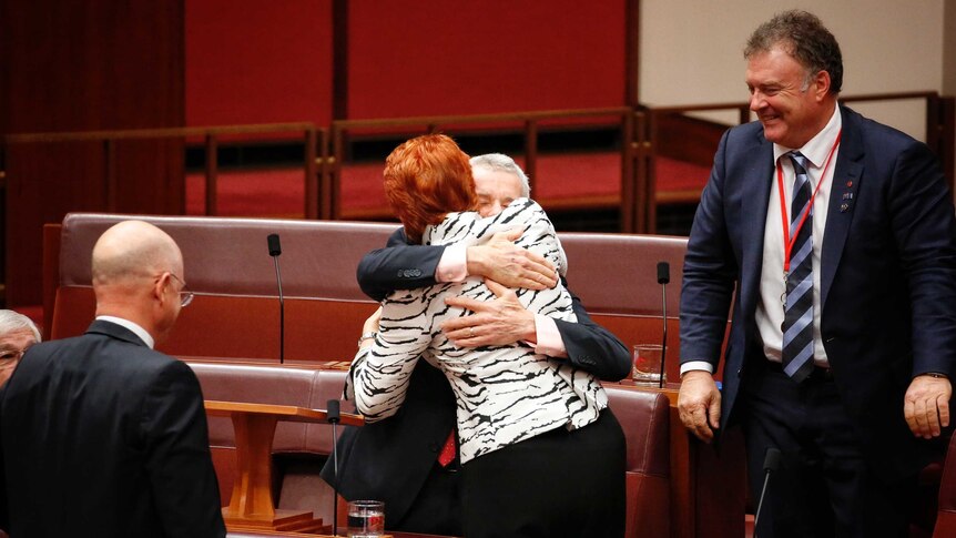 One Nation Senator Malcolm Roberts embracing Pauline Hanson in the Senate, on September 13, 2016.