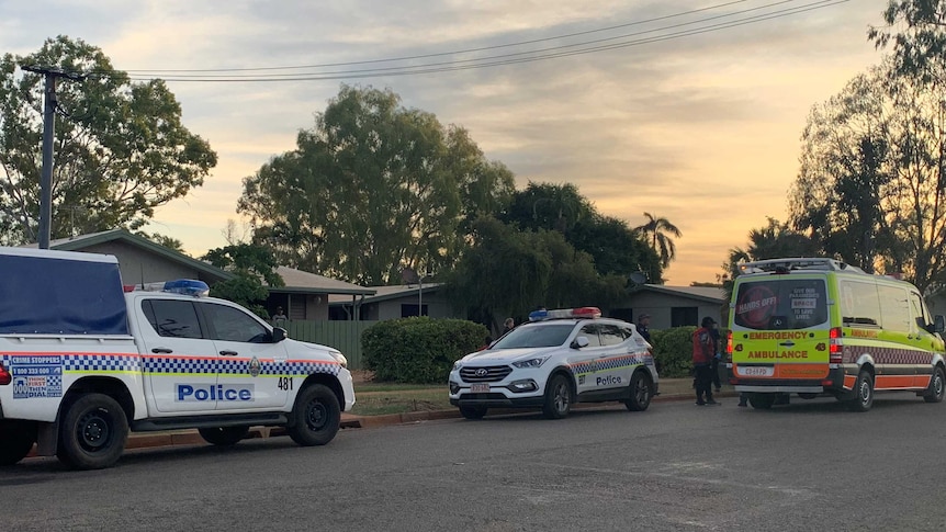 Two police cars and an ambulance are out the front of a house in Katherine East.
