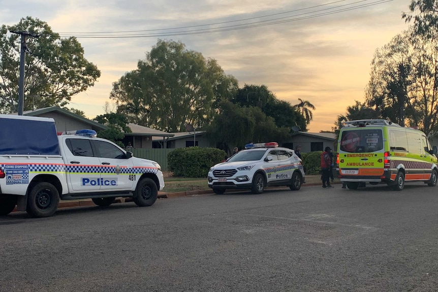 Two police cars and an ambulance are out the front of a house in Katherine East.