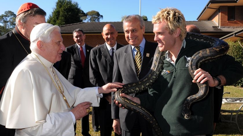 Pope Benedict XVI gets up close and personal with a snake