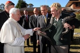 Pope Benedict XVI gets up close and personal with a snake