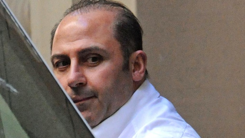 Underworld figure Tony Mokbel is lead into a prison van at the Melbourne Supreme Court on October 18, 2011.