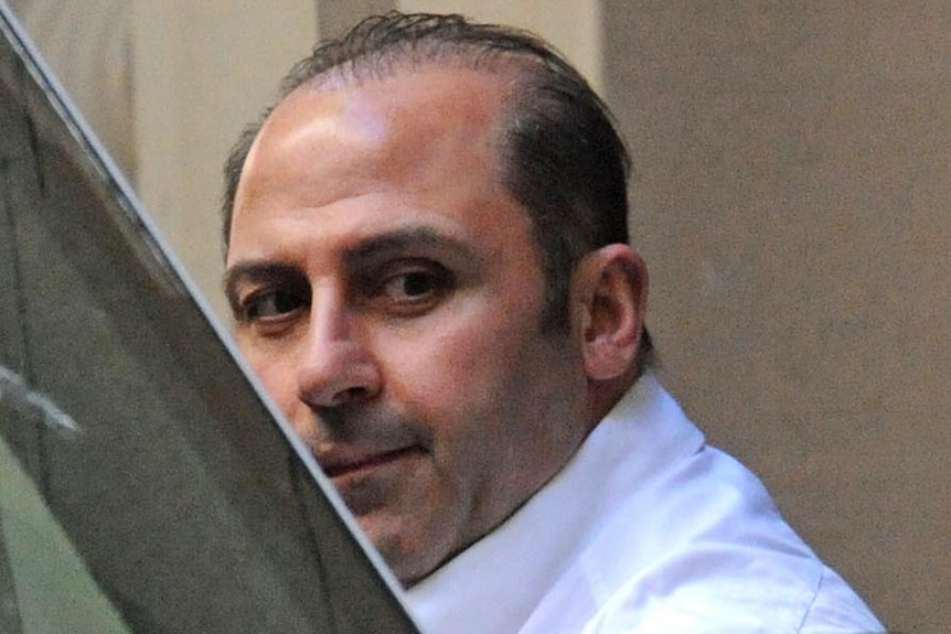 Underworld figure Tony Mokbel is lead into a prison van at the Melbourne Supreme Court on October 18, 2011.