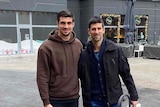 Novak Djokovic stands on the right next to Peta Djordjic in the middle of Belgrade 
