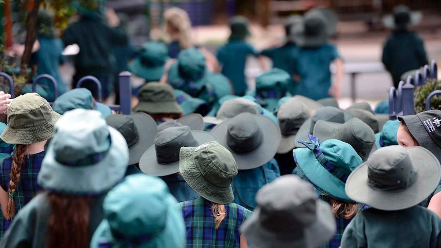 The Cancer Council says it is safe for schools to relax the requirement for students to wear hats if the UV rating is below 3.