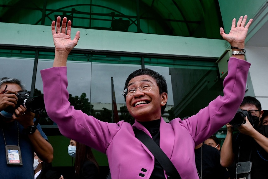  Maria Ressa gestures after she was acquitted of the tax evasion cases against her