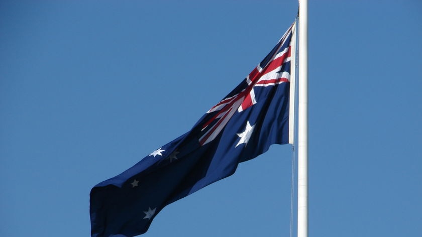 Australian flag on a pole outside the Melbourne Shrine of Remembrance