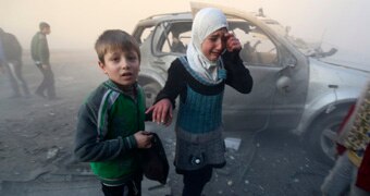 Syrian children in Aleppo street after bombing
