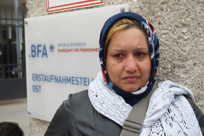 Farzona, 32, is from Afghanistan and has been stranded outside Traiskirchen's refugee reception camp in Austria for the past three days