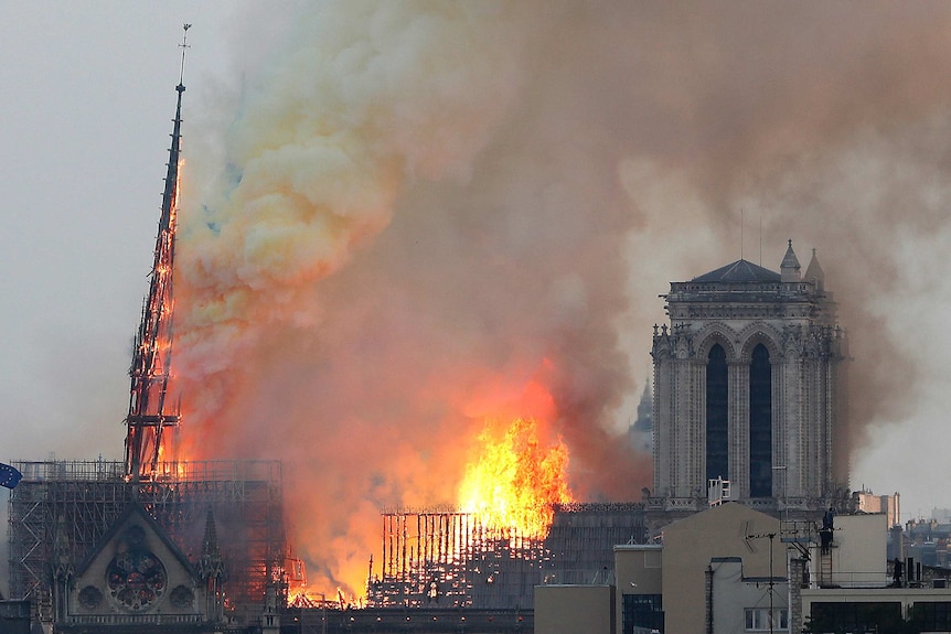 Flames rise from Notre Dame cathedral in Paris.