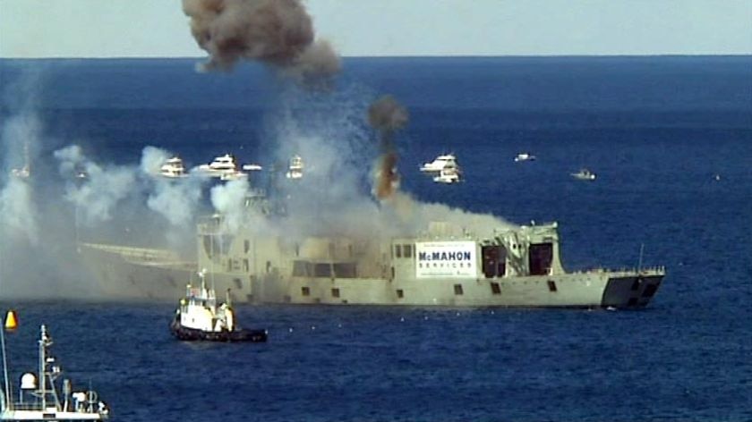 Fireworks explode off the decommissioned HMAS Adelaide as it sinks