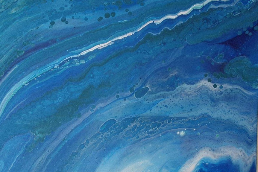 Abstract painting on a canvas, showing different shades of blue and green and white.