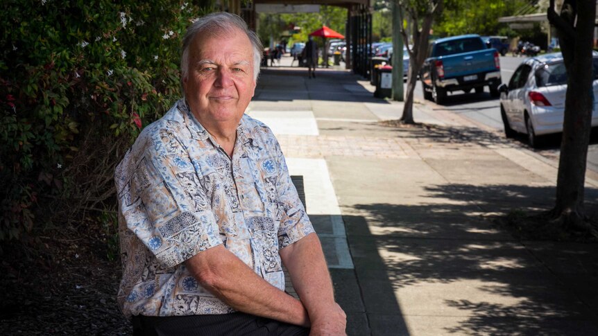 Dungog mayor Harold Johnston sits on a bench outside the town's council chambers.