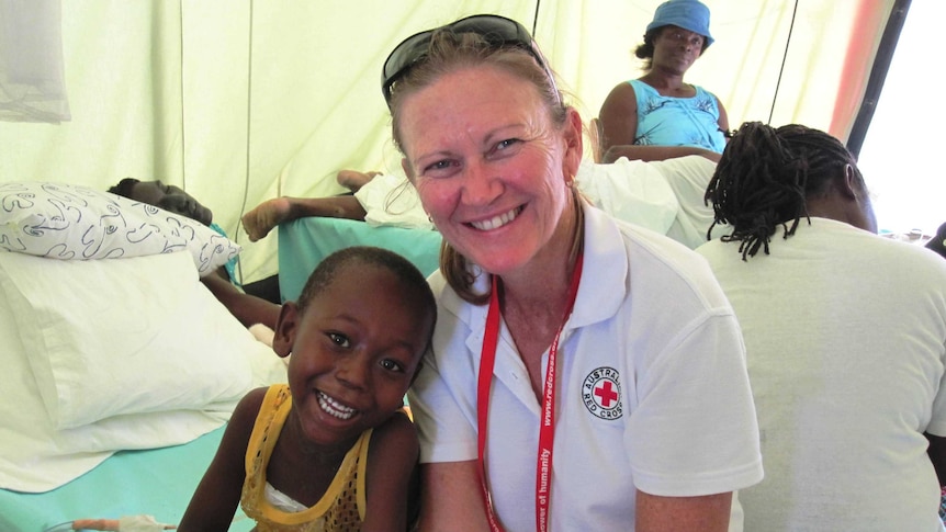 Red Cross nurse Elizabeth Bowell helping people during the 2010 Haiti earthquake