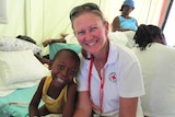 Red Cross nurse Elizabeth Bowell helping people during the 2010 Haiti earthquake
