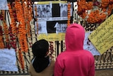 Children look at pictures of victims of Tuesday's attack on Army Public School in Peshawar December 21, 2014