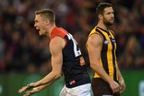 Melbourne's Tom McDonald (L) reacts after kicking a goal against Hawthorn at the MCG.