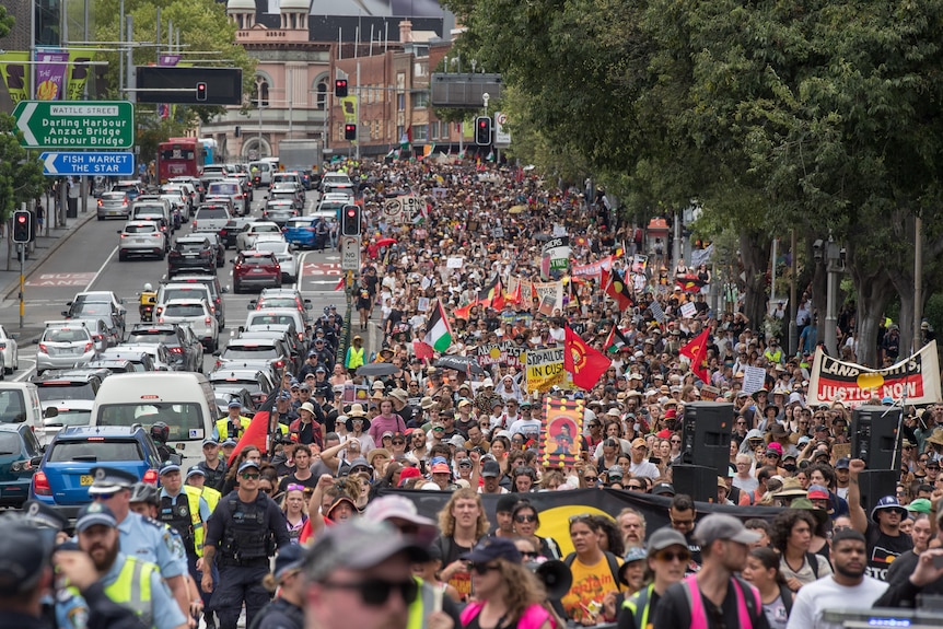 A large crowd makes its way through Sydney.