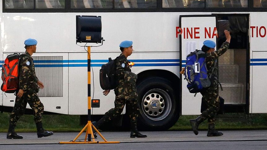 Filipino peacekeepers arrive home from Liberia