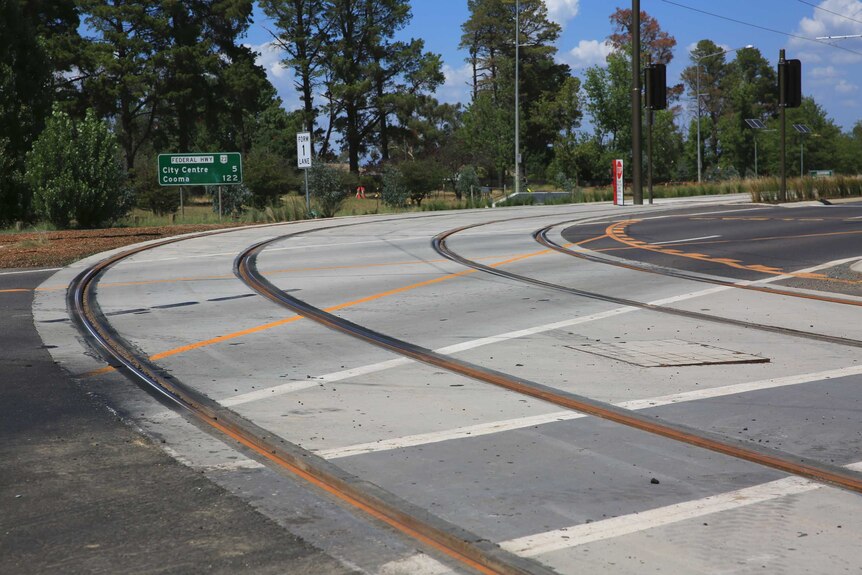 Close up of light rail tracks as they turn a corner.