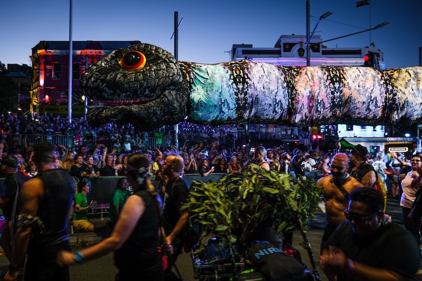 A float of a giant multicoloured serpent.