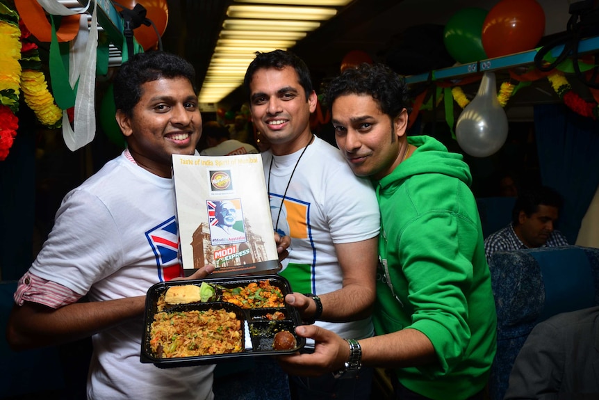 Ashwin Mangalore (left), Amith Karanth (centre) and Pradeep M.L. with the food served on the Modi Express, November 16, 2014.