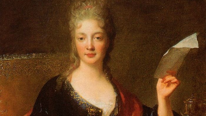 A portrait of Elisabeth Jacquet de La Guerre, holding a piece of manuscript in her left hand.