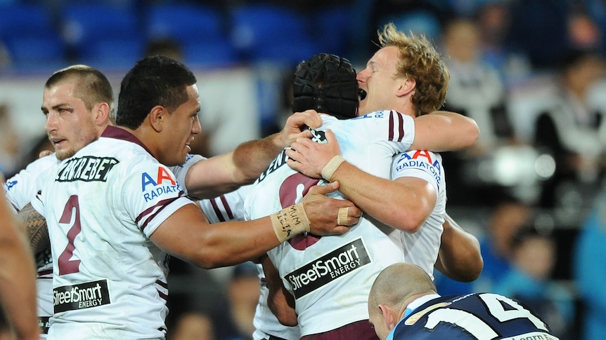 Scoring delight ... The Sea Eagles celebrate crossing for a try
