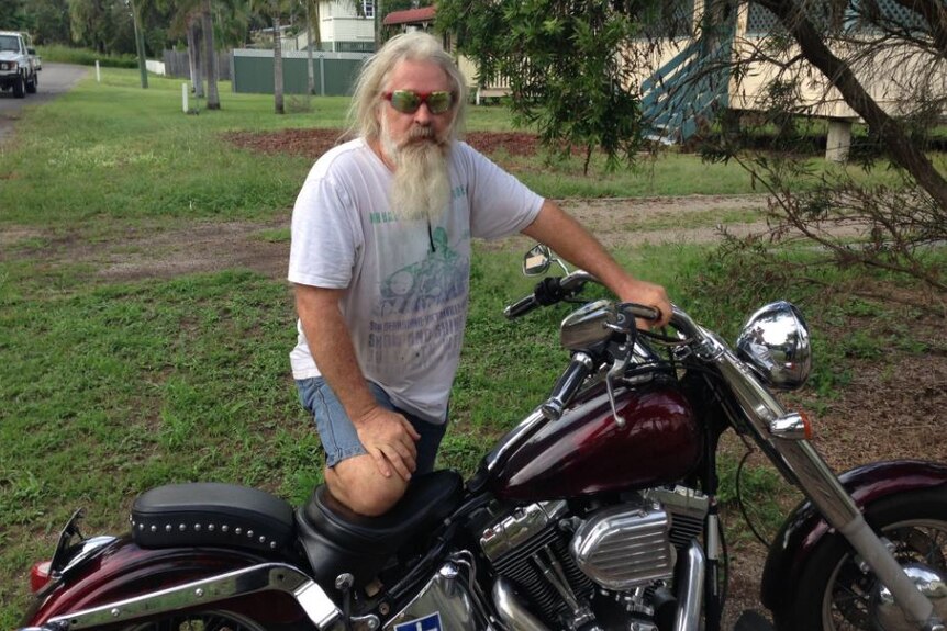 Cungulla resident Mike Kennedy with his prized Harley-Davidson motorbike.