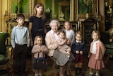 The Queen sits with her five great-grandchildren and two youngest grandchildren in the Green Drawing Room of Windsor Castle.