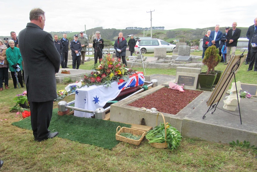 Mourners at a graveside service