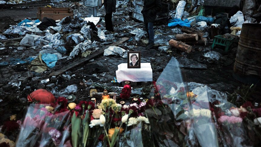 Flowers in tribute of woman killed in Ukraine protests