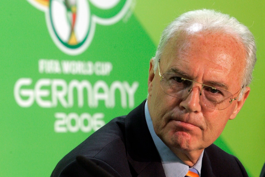 Franz Beckenbauer looks to one side
