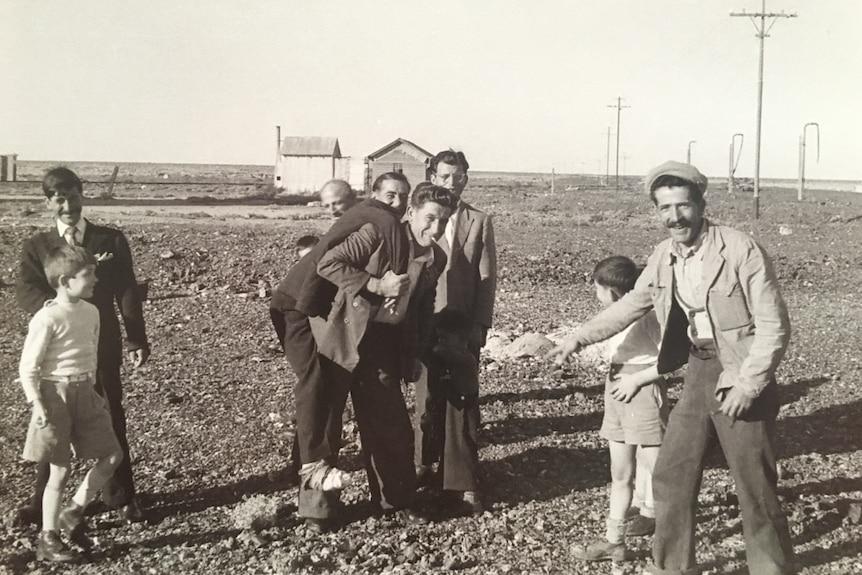 Men and boys fooling around and laughing