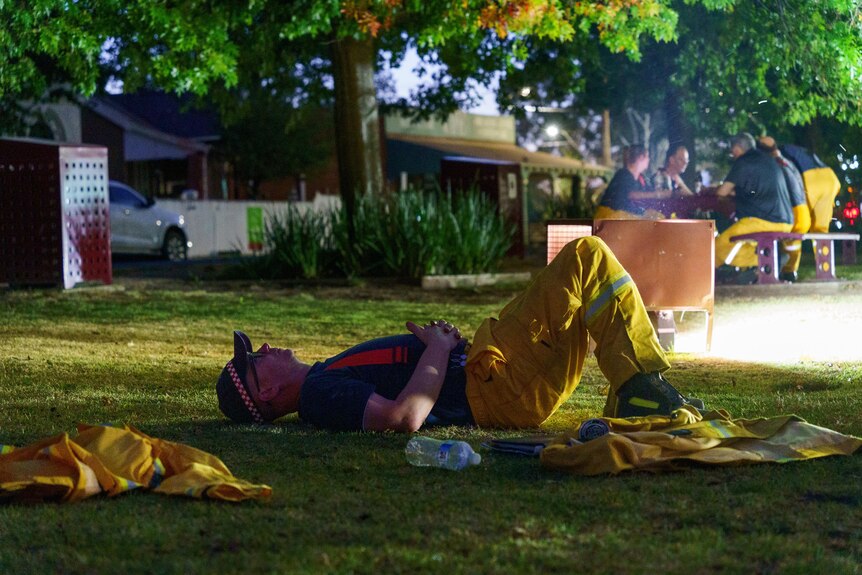 A firefighters lying on the ground