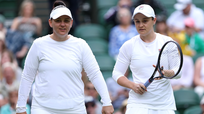 Casey Dellacqua and Ash Barty playing together at 2024 Wimbledon.
