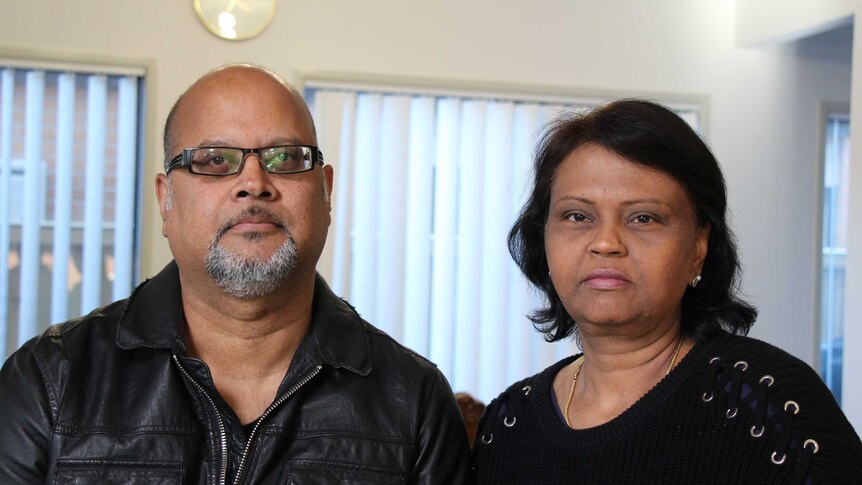 Binod Bahadur, in a black jacket and Namrata Bahadur, in a black top, inside their home.