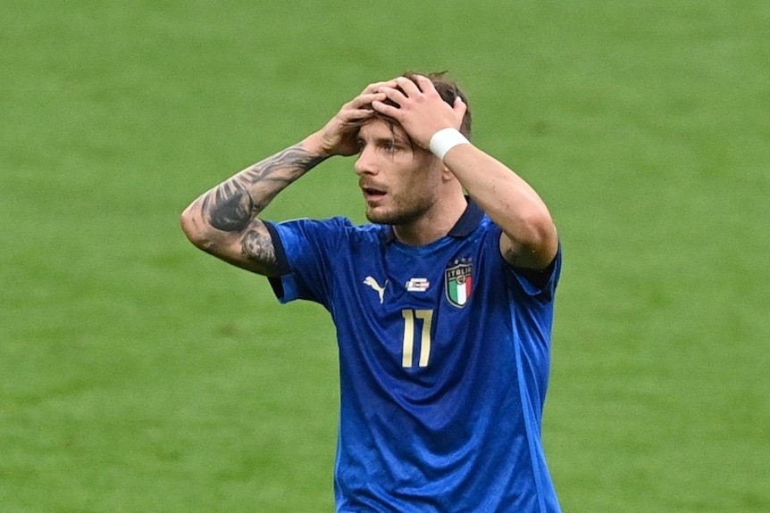 Ciro Immobile with his head in his hands.