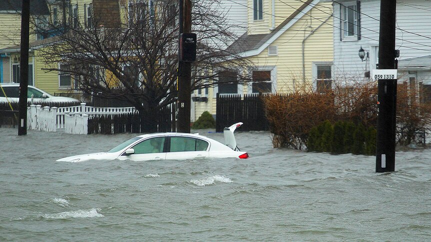 A car under several feet of water during the storm in Quincy, Massachusetts.