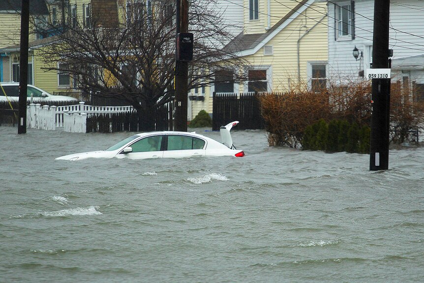 A car under several feet of water during the storm in Quincy, Massachusetts.