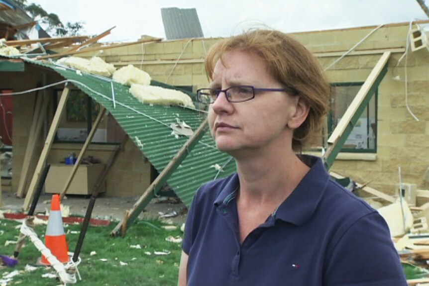 Fiona McKergow outside her parents home damaged by a storm at Forbes Creek.