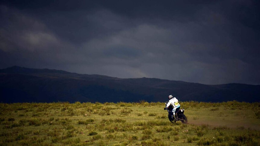 A rider in the Dakar Rally crosses a plain in Argentina