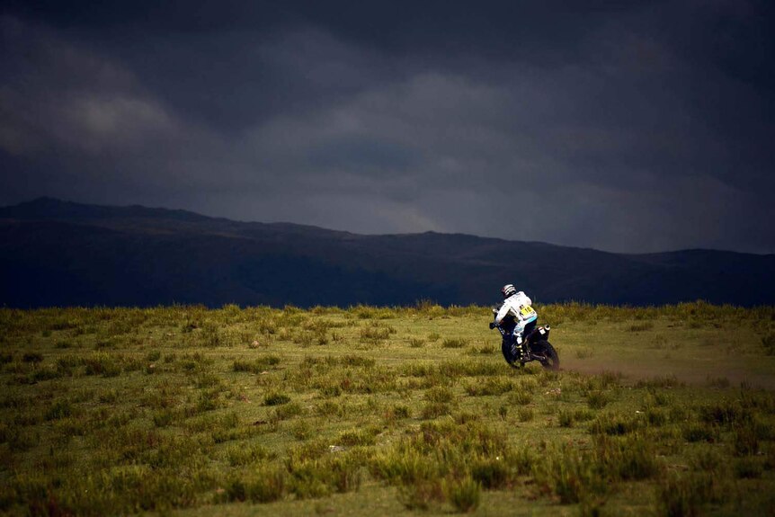 A rider in the Dakar Rally crosses a plain in Argentina