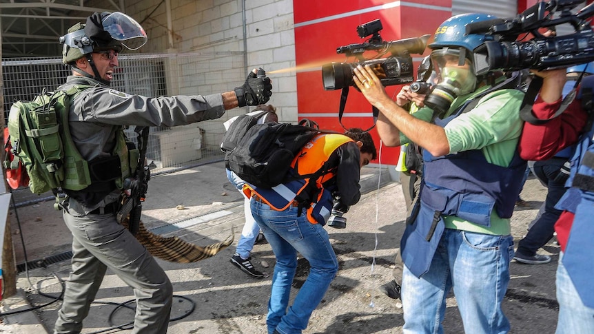 Cameraman fired with pepper spray by Israeli Officer