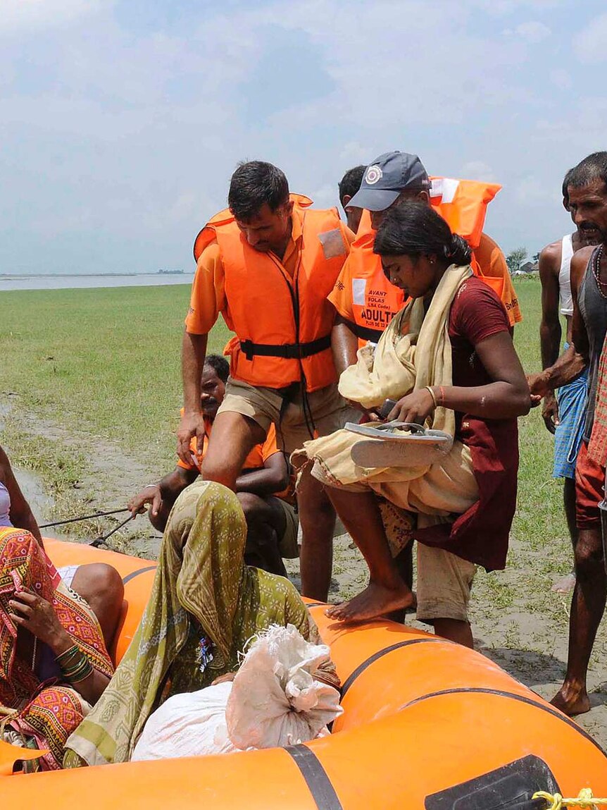 Members of India's National Disaster Response Force evacuate villagers in Supaul district in the eastern Indian state of Bihar.
