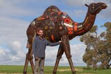 Jordan Sprigg with his life-size camel sculpture